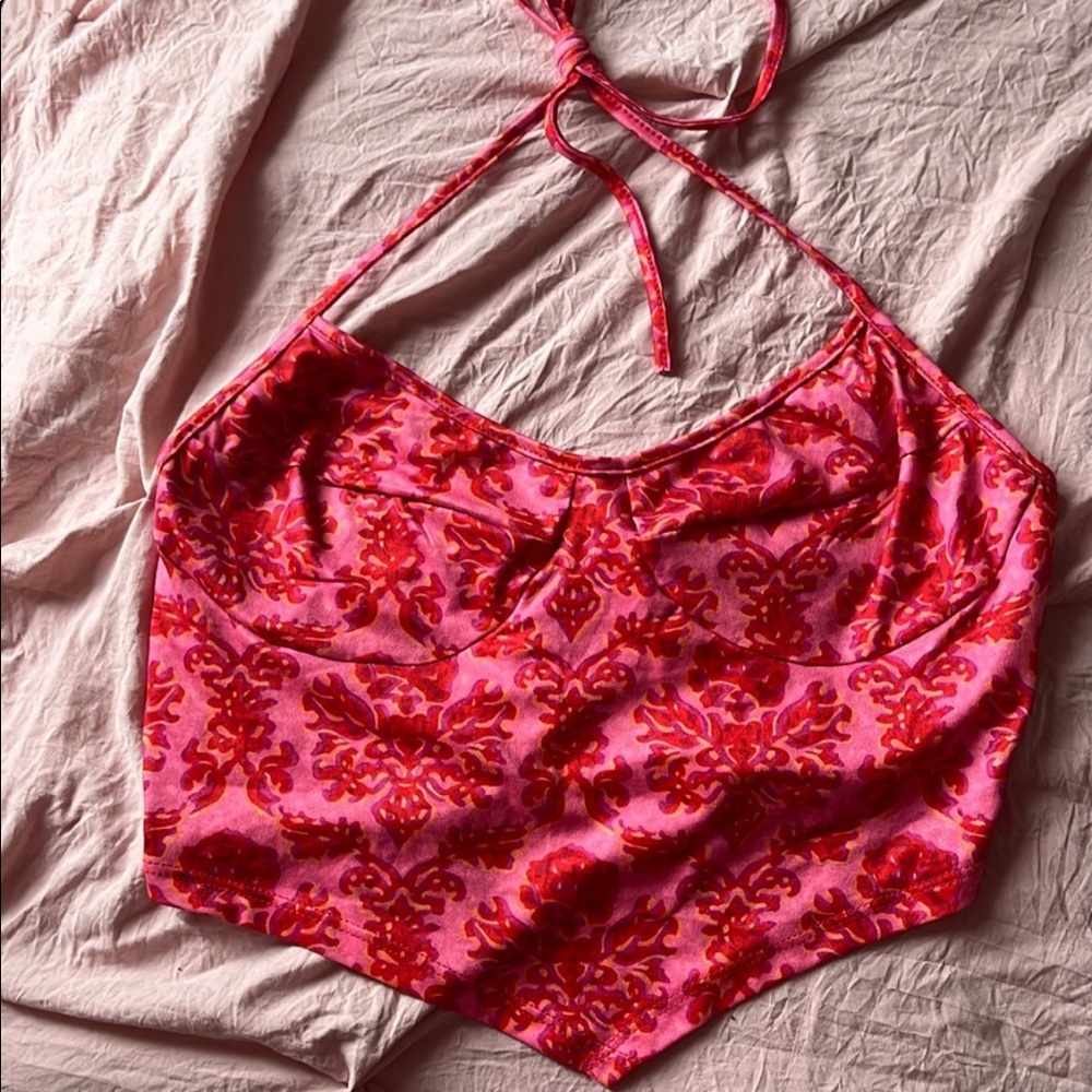 pink crop top with asymmetrical hem